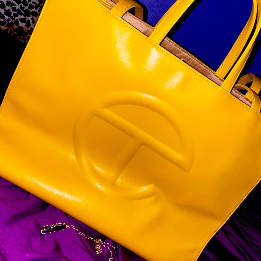 Large Sized Authentic Telfar Bag. The color is a warm golden yellow: